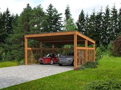 two cars are parked in a carport