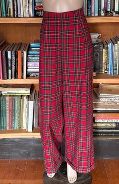 Classic 1940s Kathryn Hepburn trousers in a gorgeous red plaid. The  fabric is a washable wool - 100% wool . The pants have a high waisted style and have a faced high waist rather than a waist band. They sit 1 2" above your natural waist. Back zip closure and cuffed. Note: these are preloved , worn only once or twice, so in excellent as new condition. Size 12   approx ( Australian) Waist. 30-31" High waist. 32" Hip.   39-40" Bottom. 42" Inseam. 30" Front rise from natural waist 13.5" Back rise f