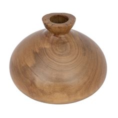 a wooden vase sitting on top of a white surface