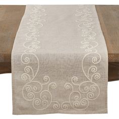 a table runner with an embroidered design on it