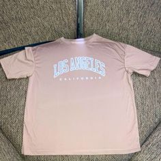 Shein T-Shirt, Los Angeles California Logo Oversized Fit In Women’s Size Small Brand New, Never Worn, In Perfect Condition W/ No Stains, Rips Or Tears Color Is A Beige/Light Coffee, Not Quite Tan But Not Quite Chocolate Brown Smoke-Free Home Make Me An Offer!! California Logo, Tshirt Oversized, Beige Light, T Shirt Oversized, Shein Tops, Los Angeles California, Fit In, Chocolate Brown, Oversized Fits