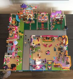 an overhead view of a play area with toys on the floor and furniture in it