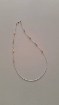 Never lose your glasses again!... As a jewelry lover and designer I've always believed that eyeglass leash should be designed as a beautiful piece of beaded jewelry. This fancy and stylish eyeglass chain fits snugly around the ends of your glasses and drapes around your neck for optional, all-day comfortable wear. This eyeglass chain features pink glass pearl and white sand bead strung onto coated jewelry wire with no slip grips at either end for an extra strong hold. Also, this eyeglass chain can be a gift for MOTHER'S DAY as well! :) Eyeglass chain measures just over 28 inches long. This eyeglass necklace product is entirely designed,created and packaged to ship from İzmir;Turkey. Adjustable Delicate Chain Glass Necklace, Adjustable Silver Glasses Chains With Delicate Chain, Eyeglass Necklace, Stylish Eyeglasses, Eyeglass Chain, Necklaces, Glasses Chain, Bead Stringing, Eye Wear Glasses