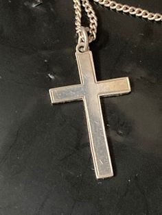 925 Sterling silver plain religious cross pendant necklace on chain Pendant height 4 cm   Total Weight 4 grams  Chain length  45 cm   All my silver is hallmarked /stamped and unpolished ... it will come with a silver polishing cloth. If you would like it dip cleaned before posting please let me know in the message section.  This is my sole small business .. I post daily and combine postage. All purchases come with full Etsy cover .. I am an established Etsy star seller and have sold over 20,000 items with 5 star reviews so please buy with confidence and ask any questions   Kind regards and thanks for looking  yours nostalgically Karen at LaLa ( loved and loved again ) xx Hallmarked Silver Cross Necklace, Silver Hallmarked Cross Necklace, Hallmarked Sterling Silver Cross Necklace, Silver Engraved Cross Pendant Necklace, Silver Cross Necklace Stamped 925, Silver 925 Stamped Cross Necklace, Silver 925 Stamped Cross Pendant Necklace, Silver Crucifix Necklace With Polished Finish, Hallmarked White Gold Cross Necklace