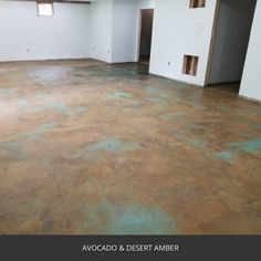 an empty room with green paint on the floor