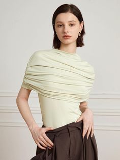 This is a modern and feminine top by yyiam that is made out of high quality and sturdy fabric. With unique design detail and trendy mood, you can style it for your clean and casual daily outfit.- Shawl detail on the top- Shirring detail- Slim silhouette Chic Fitted Knit Top With Foldover Design, Chic Fitted Knit Top With Foldover, Chic Fitted Foldover Knit Top, Trendy Stretch Tops For Office, Trendy Stretch Tops For The Office, Stretch Foldover Top For Work, Versatile Short Sleeve Office Tops, Modern Stretch Blouse, Elegant Fitted Knit Top For Workwear