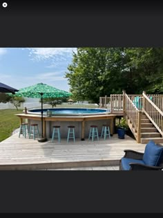 an above ground pool surrounded by chairs and umbrellas