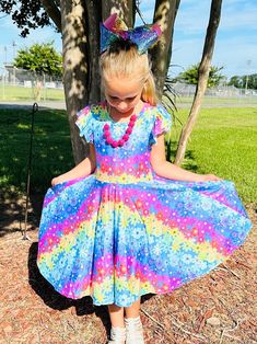 Rainbow Daisy Twirl Dress. Huge twirl, soft and comfy, stretch waistline, modest cut perfect for any occasion Casual Floral Print Twirl Dress For Spring, Playful Fitted Twirl Dress With Floral Print, Casual Spring Twirl Dress With Flutter Sleeves, Casual Summer Twirl Dress With Flutter Sleeves, Modest Stretch Dresses For Spring, Cute Spring Twirl Dress With Stretch, Cute Spring Stretch Twirl Dress, Cute Stretch Twirl Dress For Spring, Pink Casual Twirl Dress With Flutter Sleeve