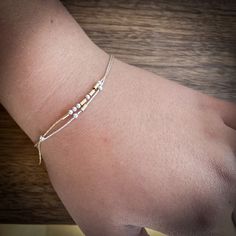 "This Morse code bracelet have beads floating on a delicate specialty chain. The mixed metal beads form a sophisticated, modern design. It is a subtle way to send your love message. Also a perfect daily reminder for love, inspiration, and mental health. ❤️ Matching morse code necklace: https://etsy.me/31Vv2Qm ∙ ∙ ∙ ∙ ∙ ∙ ∙ ∙ ∙ ∙ ∙ ∙ ∙ ∙ ∙ ∙ ∙ ∙ ∙ ∙ ∙ ∙ ∙ ∙ ∙ ∙ ∙ ∙ ∙ ∙ ∙ ∙ ∙ ∙ ∙ ∙ ∙ FEATURES ▶ All materials are sterling silver and 14K gold filled. Hypoallergenic. Suitable for sensitive skin. ▶ Be Message Names, Inspiration Words, Morse Code Necklace, Morse Code Bracelet, Love Inspiration, Morse Code, Dainty Bracelets, Metal Beads, Daily Reminder