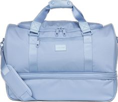 a light blue duffel bag on a white background