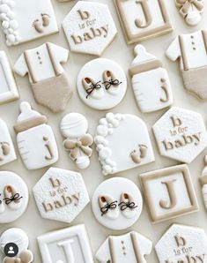 baby shower cookies are arranged on a table