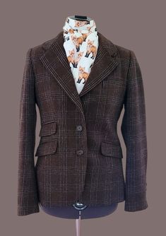 "What a find!  Zara Brown Plaid tweed Hunting Jacket.  (Stock Tie sold separately).  Women's S, 34 chest This beauty is such a great find!  Absolute beautiful brown wool.  Will look gorgeous with tan breeches, multiple ties. Shoulders 15\" Chest 34\" Back length 26\" Sleeves 25\" Appears to be in excellent, used condition.  There is a repair inside the right pocket.  The pocket lining has a sewing repair, not seen.  Otherwise all looks great." Luxury Tailored Brown Tweed Jacket, Brown Tweed Jacket For Tailoring, Winter Fitted Tweed Jacket With Welt Pockets, Fitted Winter Tweed Jacket With Welt Pockets, Fitted Tweed Jacket With Welt Pockets For Winter, Brown Tweed Jacket For Office, Fitted Brown Tweed Sport Coat, Tailored Tweed Office Jacket, Plaid Wool Tweed Jacket For Tailoring