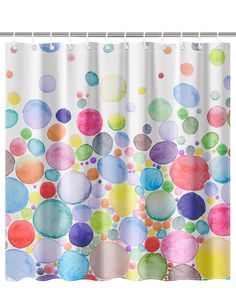 a shower curtain with colorful circles on it