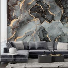 a modern living room with black and gold marble wallpaper, grey couches and white rugs