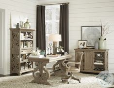 a living room filled with furniture next to a window and a rug on the floor