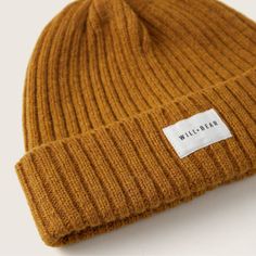 Stay warm this season with Levi Mustard, a unique beanie made of Renewable Australian wool with a warm fleece liner to keep your ears extra warm. Its mustard textured wool base is complimented by a stylish cotton logo banner, perfect for a vintage 70's look. Levi comes in one size fitting from 51cm-59cm. It is a firm fit and will stretch with wear. Affordable Beanie For Everyday Use, Cheap Everyday Beanie For Fall, Cheap Cotton Beanie For Fall, Cheap Warm Beanie For Fall, Affordable Adjustable Brown Beanie, Cheap Warm Solid Beanie, Cheap Warm Cotton Beanie, Mustard Wool Hat, Warm Yellow Hats For Fall