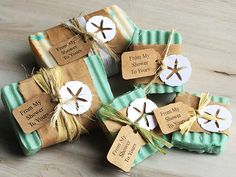 four soap bars wrapped in brown paper and tied with twine