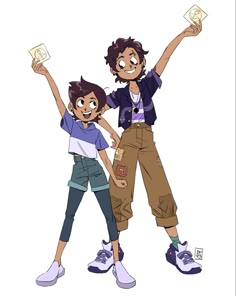 two young boys standing next to each other with their arms in the air and one boy holding