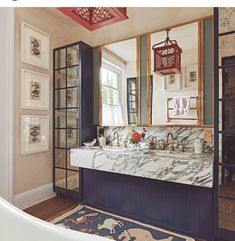 a bathroom with a sink, mirror and bathtub