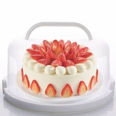 a white cake with strawberries on top