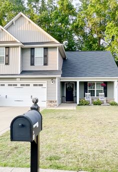 a mailbox sitting in front of a house