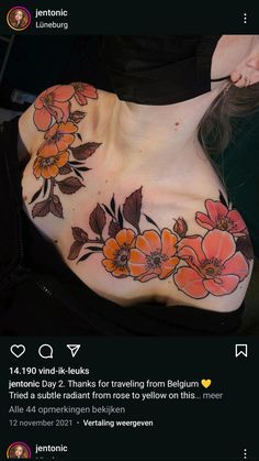 a woman's chest with flowers painted on it and the bottom half of her stomach