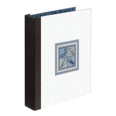 a white binder with blue trim and two pictures on the front, hanging from a wall