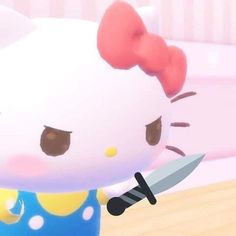 an animated hello kitty holding a knife and wearing a blue shirt with white polka dots