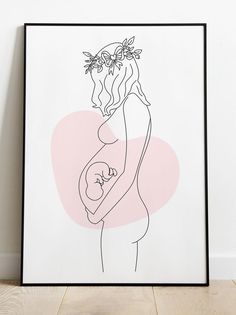 a black and white drawing of a woman holding a baby in her arms with a pink background