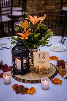 the table is set with candles and flowers