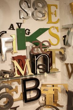 there are many metal letters on the wall