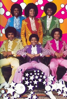 the jacksons posing for a photo in front of a colorful background with stars and bubbles