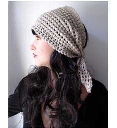 a woman with long hair wearing a knitted hat