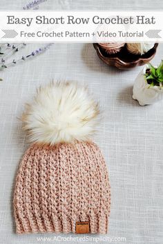 the easy short row crochet hat is knitted with a pom - pom