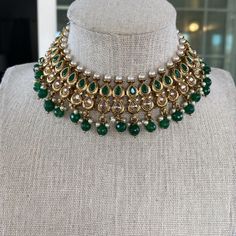 This gorgeous Emerald Necklace set is made from fine polki stones. Comes as a set with earrings and a head piece. ALL SALES ARE FINAL ON JEWELRY. KINDLY MESSAGE ME FOR ANY INQUIRIES. Kundan Jeweled Necklace For Party, Kundan Chandbali Necklace With Jewels, Bollywood Festive Jeweled Necklaces, Bollywood Style Jeweled Festive Necklaces, Bollywood Style Kundan Necklace With Jewels, Bollywood Style Festive Necklace With Jewels, Bollywood Style Festive Jeweled Necklaces, Kundan Jewelry Sets For Celebration, Festive Kundan Jewelry Sets