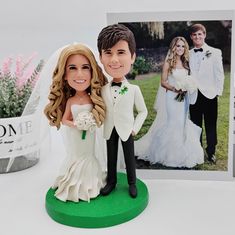 a bride and groom cake topper next to a card with the same photo on it