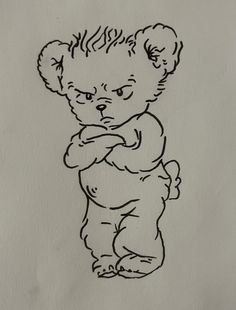 a black and white drawing of a teddy bear with arms crossed, on a sheet of paper