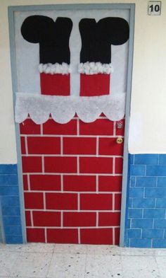 a door decorated to look like mickey mouse's house with red and white bricks