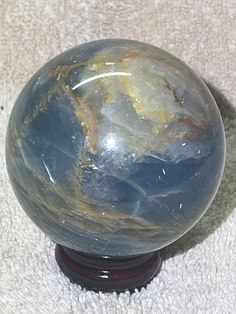 Caribbean Calcite Sphere with wooden holder.  14.4 oz or 409g Caribbean Calcite, Crystal Gems, Crystal Jewelry, Home Accents, Display Homes, Gems, Paper Party Supplies