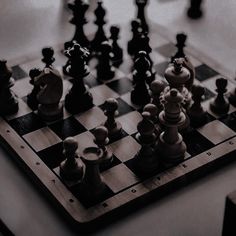 black and white chess board with pieces on it