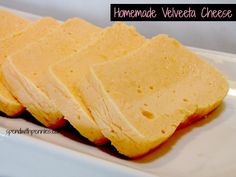 three pieces of yellow cake sitting on top of a white plate next to each other