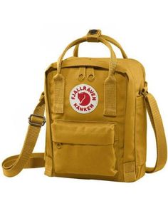 This crossbody sling is perfect for the Kanken lover who is looking for a more compact bag to carry their essentials. 8" x 6" adjustable straps front pocket 100% vinyl Sling Bag Fjallraven, Fjallraven Kanken Mini Bag, Fjallraven Kanken Mini Green, Fjallraven Ochre, Kanken Sling, Fjällräven Kånken, Mini Cooler, Sequin Backpack, Compact Bag