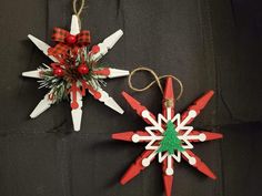 two christmas decorations are hanging on the wall