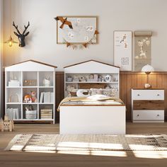 a bedroom with white furniture and wooden flooring