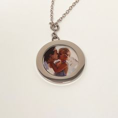 Our Delicate locket is a sweet and simple version of our locket! It’s a minimalistic and modern twist to the vintage locket. The Delicate lockets do not have a removable cover. ** DETAILS ** Lobster ClaspSignature Chain Gift Box Included with additional feeComplimentary photo printing included!** MEASUREMENTS **Locket Measurement - 27.5MM Diameter (slightly larger than a quarter)Standard Chain Length - 18 Inches Round Locket Necklace With Detachable Pendant As Gift, Everyday Silver Locket Necklace, Stainless Steel Locket Pendant Necklace, Everyday Minimalist Round Pendant Locket Necklace, Silver Minimalist Locket Necklace For Everyday, Personalized Silver Locket Necklace For Everyday, Minimalist Personalized Locket Necklace For Keepsakes, Stainless Steel Locket Necklace Gift With Round Pendant, Stainless Steel Locket Necklace With Round Pendant For Gift