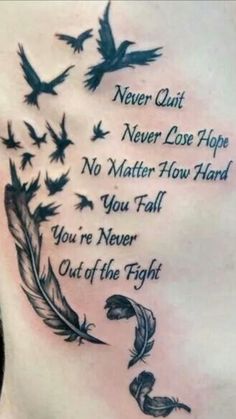 the back of a man's stomach with birds flying around it and an ink quote on