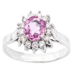 18kt white gold pink sapphire and diamond cluster ring Made in the 1970s Tested positive for 18kt gold. Dimensions - Weight : 5.5 grams Size: 2.6 x 2.2 x 1.8 cm Finger Size (UK) = Q (US) = 8 1/2 (EU) = 57 1/2 Pink Sapphire - Cut: Oval Size: 1 ct Treatment: Natural Diamonds - Cut: Round brilliant cut Quantity of stones: 13 Total weight: 0.39 ct Clarity: SI1 Colour: F Condition: Pre-owned, minor wear, excellent overall condition. Diamond Cluster Ring, Diamond Cluster, Sapphire Diamond, Ring Ring, Cluster Ring, Hermes Birkin, Round Brilliant Cut, Pink Sapphire, Natural Diamonds