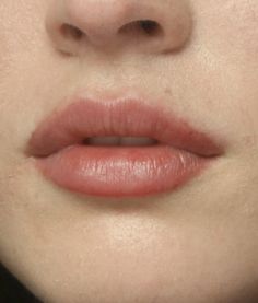 a woman's lips are shown with no makeup