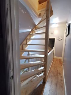 there is a wooden stair case in the house