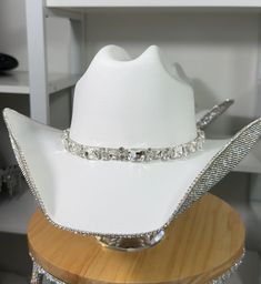 Elegant White Hat With Rhinestones, White Party Hat With Rhinestones, Elegant Silver Hats With Bling, Elegant Rhinestone Hats For Country Events, Elegant Silver Hat With Bling, Adjustable White Hat Bands For Party, Glamorous Adjustable Hat With Rhinestones, Glamorous Adjustable Rhinestone Hat, Western Wedding Hat With Rhinestones